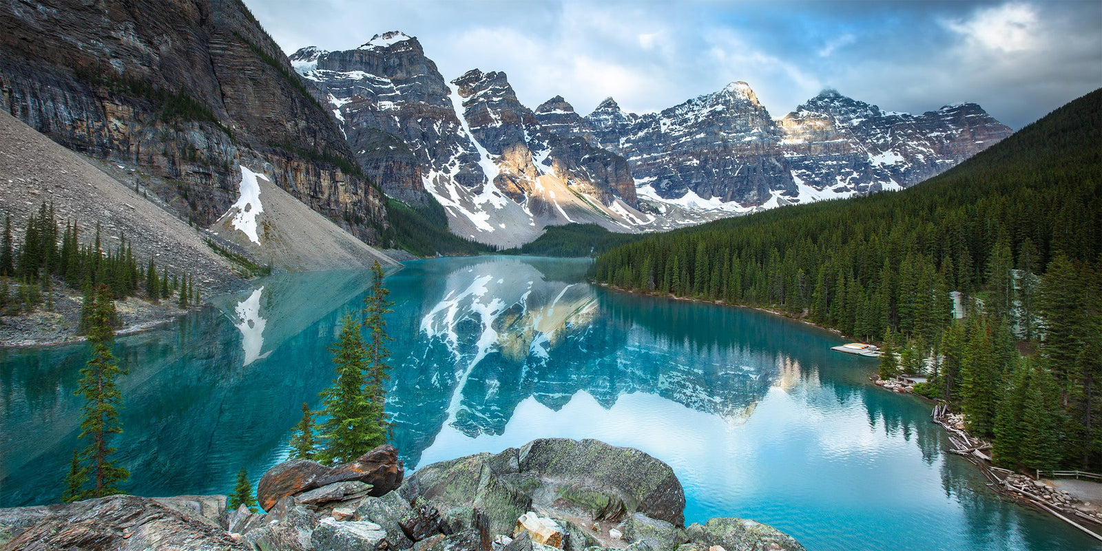Turquoise water of Moraine Lake beneath a row of rugged peaks, Banff National Park, Alberta