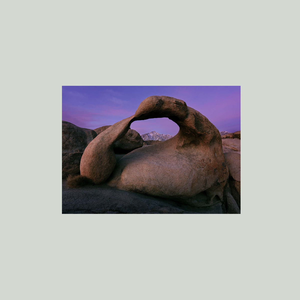 Earth's Embrace, Mobius Arch framing the Sierra Nevada under a violet sky before sunrise in the Alabama Hills, California, as an unframed print