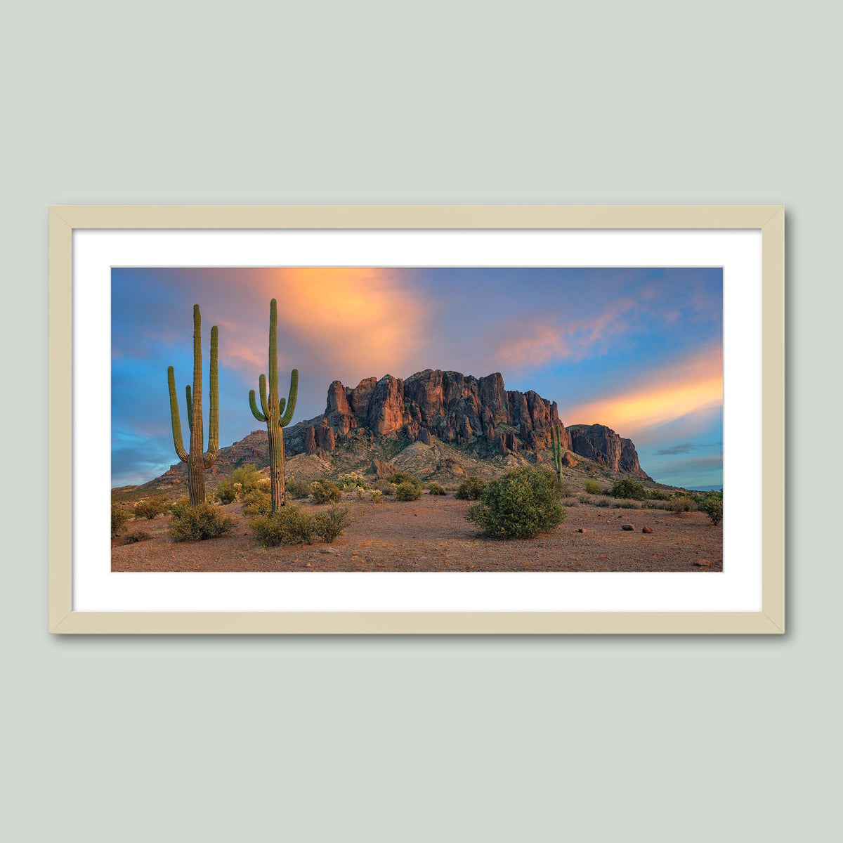 The Gold Was Always Here, saguaro cacti before the Superstition Mountains glowing at sunset in Arizona, in a maple frame with a white mat