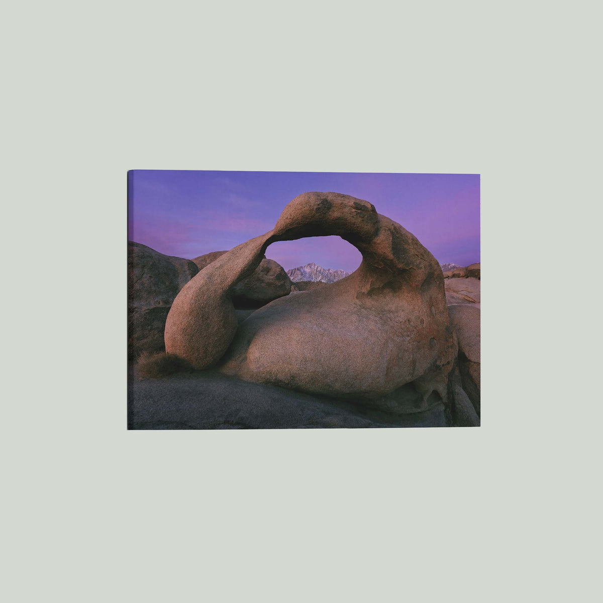 Earth's Embrace, Mobius Arch framing the Sierra Nevada under a violet sky before sunrise in the Alabama Hills, California, as a stretched canvas shown at an angle