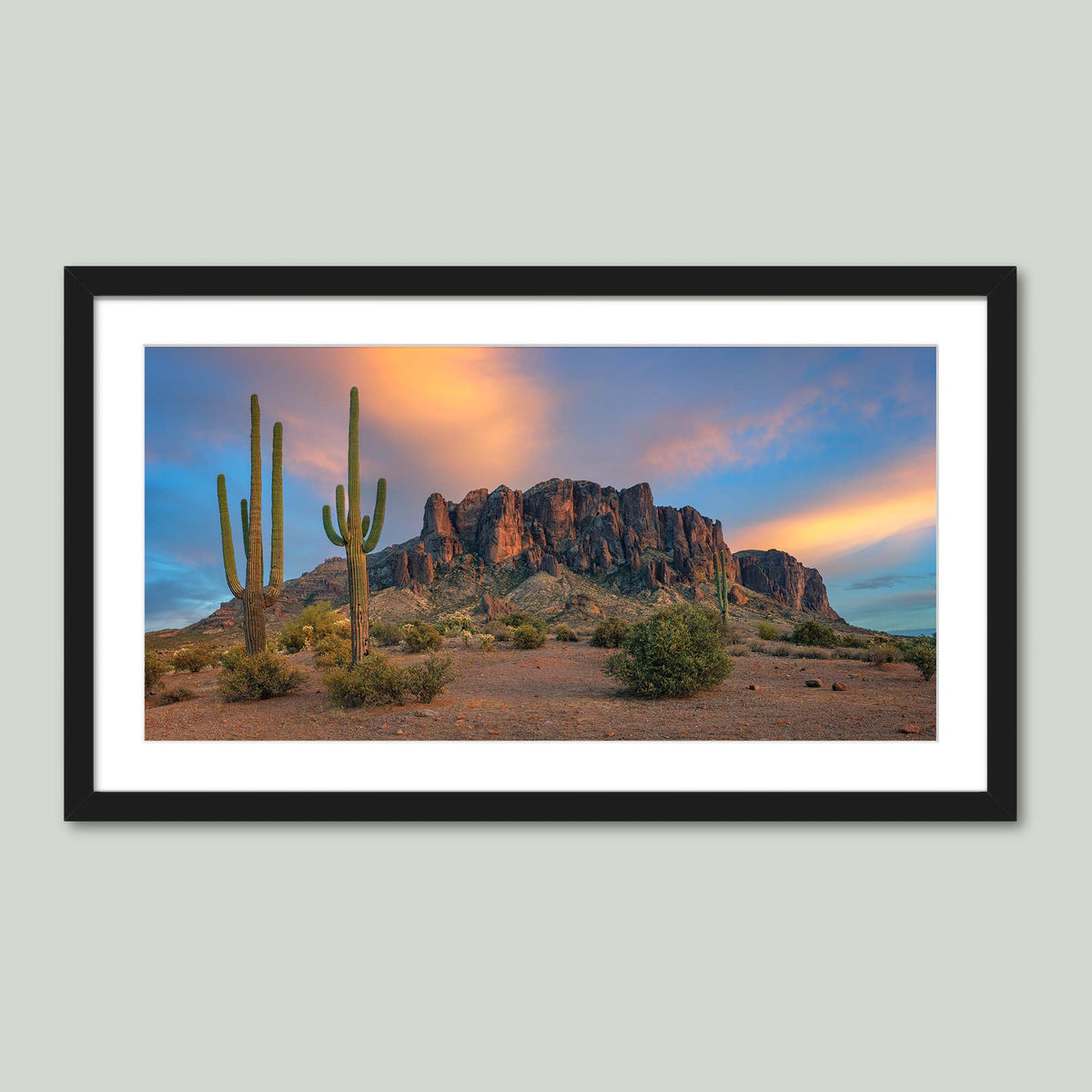The Gold Was Always Here, saguaro cacti before the Superstition Mountains glowing at sunset in Arizona, in a black frame with a white mat