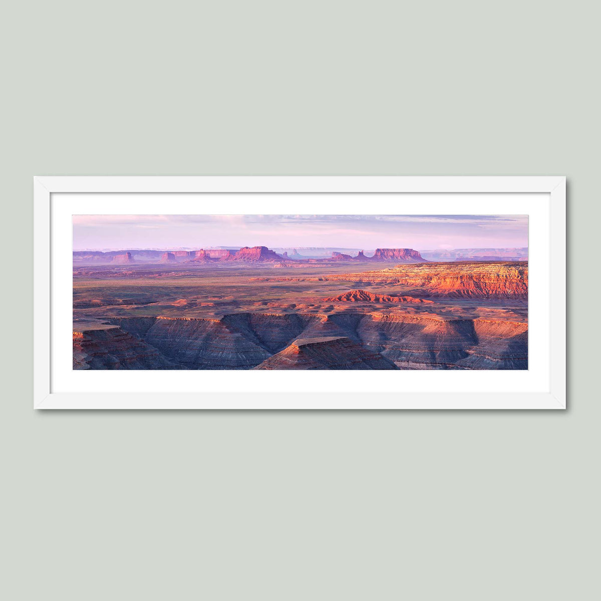 Muley Point, sunrise over the San Juan River canyons with Monument Valley in the distance, from Muley Point in Utah, in a white frame with a white mat