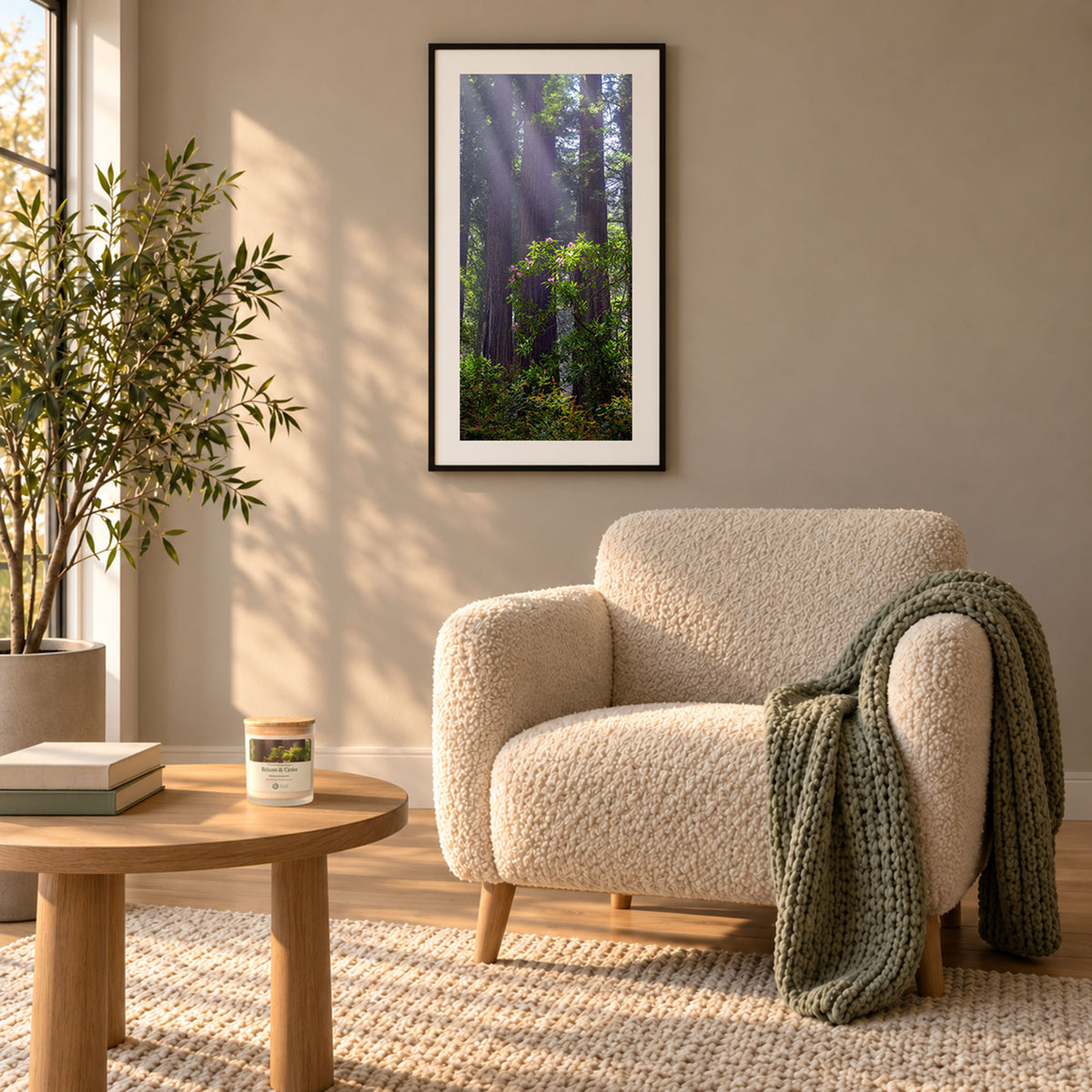 The Forest Gift Set at home: the Gentle Giants print and the Gentle Giants Candle in Balsam and Cedar, lit on an oak table in warm candlelight
